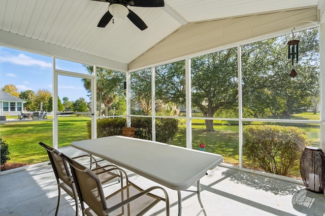 sunroom / solarium featuring ceiling fan, lofted ceiling, and plenty of natural light