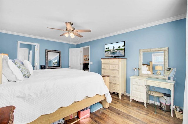 bedroom featuring baseboards, ceiling fan, wood finished floors, and crown molding