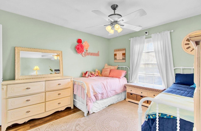 bedroom featuring ceiling fan and wood finished floors