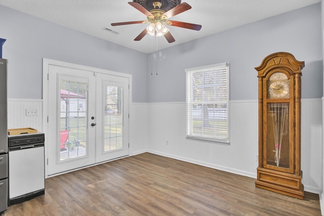 entryway with dark hardwood / wood-style flooring, ceiling fan, french doors, and a healthy amount of sunlight