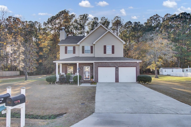 front facade featuring a porch, a front yard, and a garage