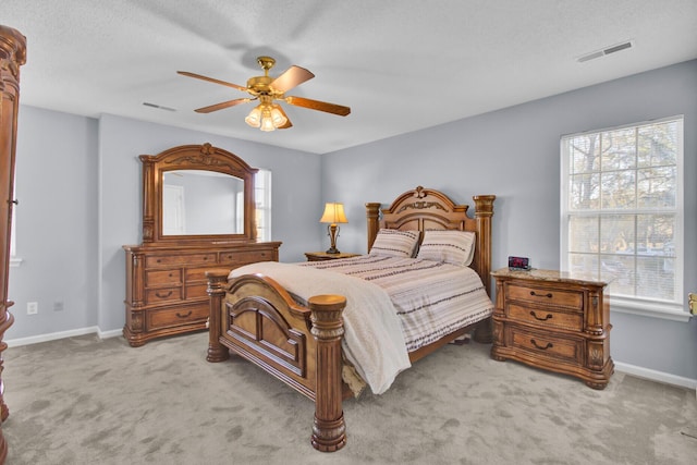 bedroom with light colored carpet and ceiling fan