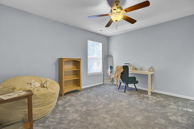 carpeted office space with ceiling fan