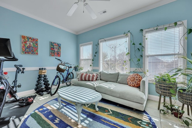 exercise room featuring light tile patterned floors, crown molding, ceiling fan, and a healthy amount of sunlight