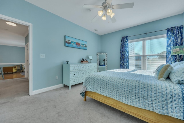 bedroom with ceiling fan and light carpet