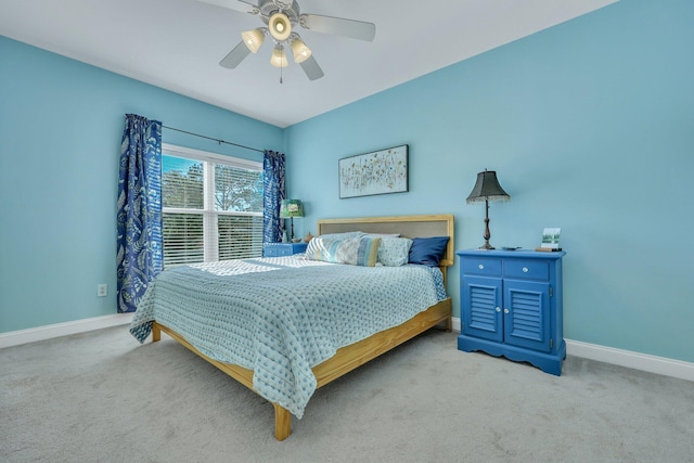 bedroom featuring ceiling fan and light carpet