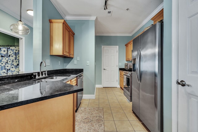 kitchen featuring pendant lighting, crown molding, sink, light tile patterned floors, and stainless steel appliances