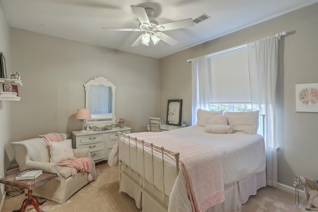 bedroom with ceiling fan and light colored carpet