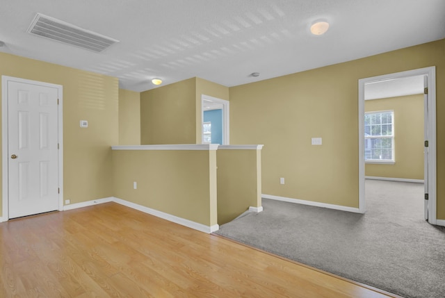 spare room featuring light hardwood / wood-style flooring