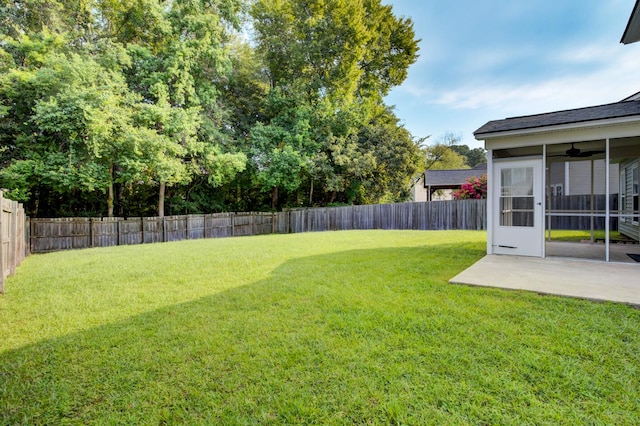 view of yard with a patio and ceiling fan