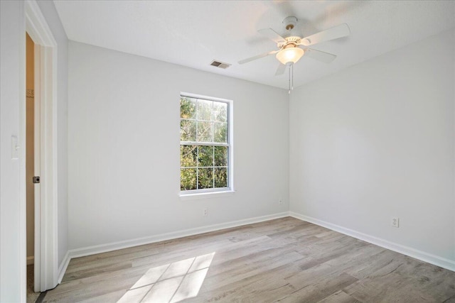 unfurnished room with ceiling fan and light hardwood / wood-style flooring