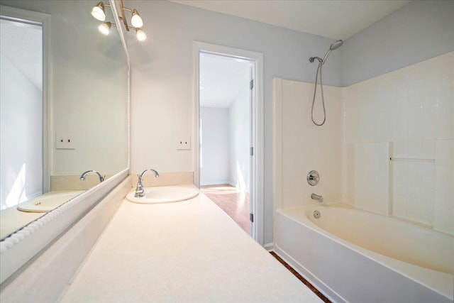 bathroom featuring shower / bathing tub combination, vanity, and wood-type flooring