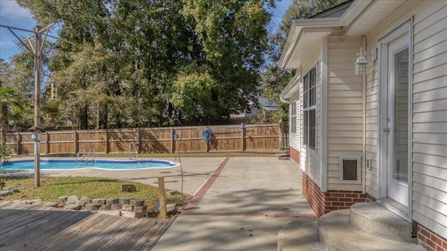 view of swimming pool with a patio area