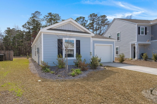 view of front of property with driveway, a garage, a front lawn, and board and batten siding