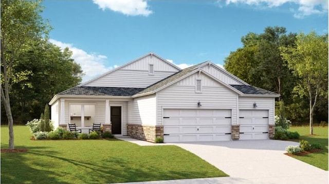 view of front of house featuring a garage and a front lawn