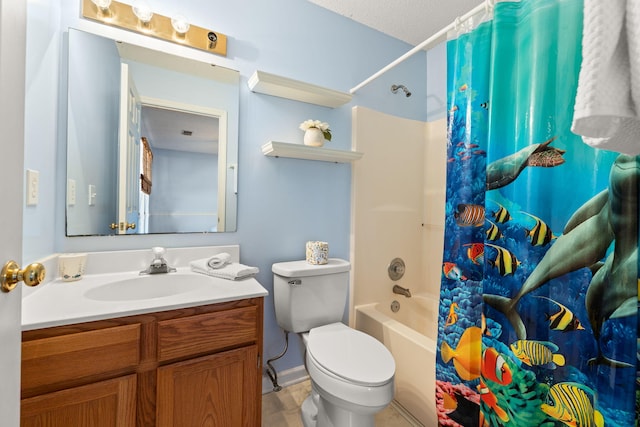 bathroom featuring vanity, toilet, and shower / bath combo with shower curtain