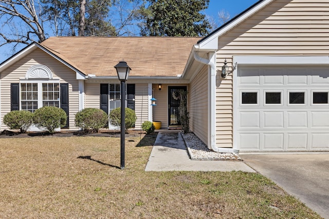 single story home featuring a garage, a front lawn, and a shingled roof