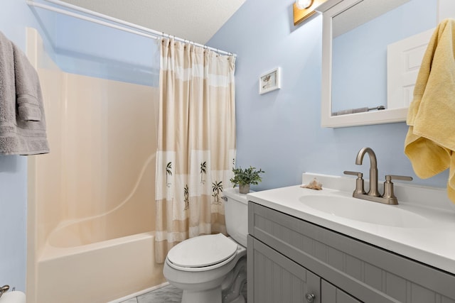 bathroom featuring toilet, shower / bath combo with shower curtain, a textured ceiling, and vanity