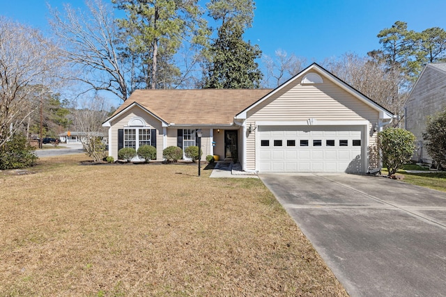 ranch-style home featuring a garage, concrete driveway, and a front yard