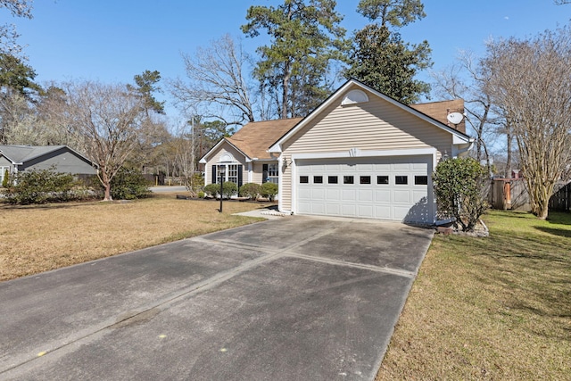 single story home with a garage, fence, a front lawn, and concrete driveway