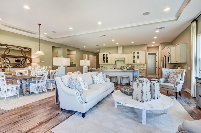 120 Magnolia House Dr, Summerville, SC 29486 - living area featuring light wood-style flooring, recessed lighting, and ornamental molding