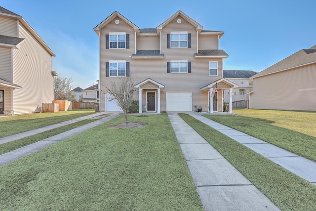 view of front facade with a garage and a front yard