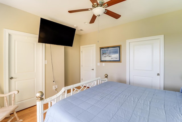 unfurnished bedroom with a ceiling fan and light wood-style floors