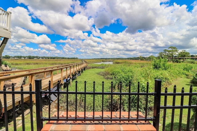 view of yard featuring a rural view and fence