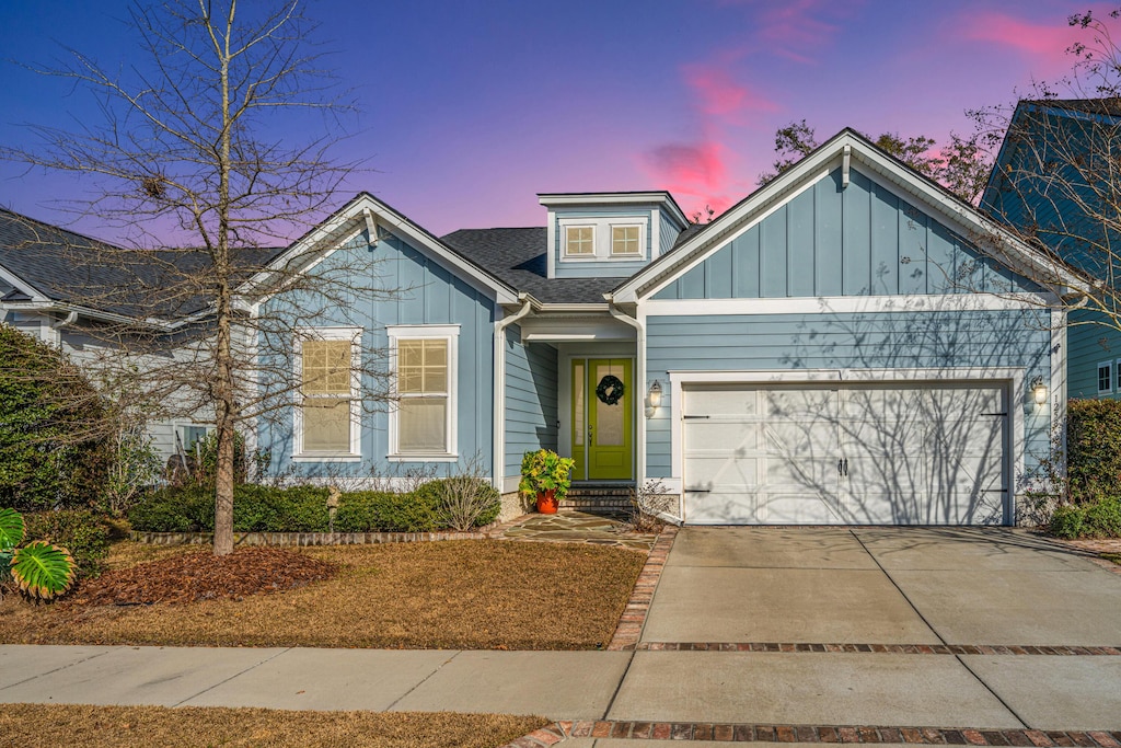 view of front of property with a garage