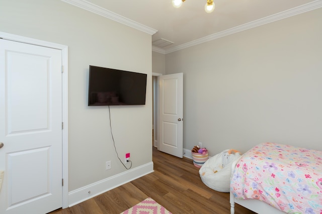 bedroom featuring crown molding and wood-type flooring