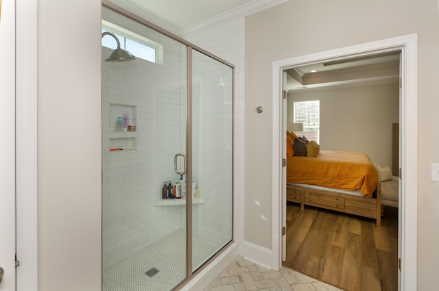 bathroom with hardwood / wood-style flooring, ornamental molding, and walk in shower