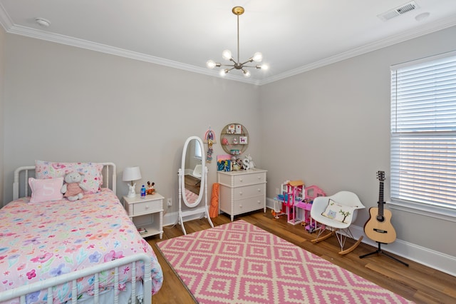 bedroom with dark wood-type flooring, ornamental molding, an inviting chandelier, and multiple windows