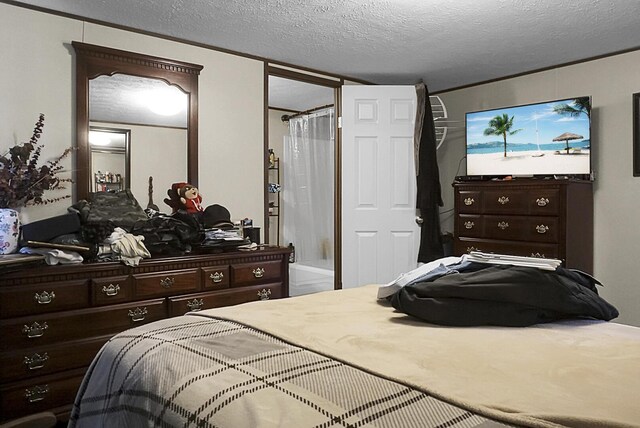 bedroom featuring a textured ceiling