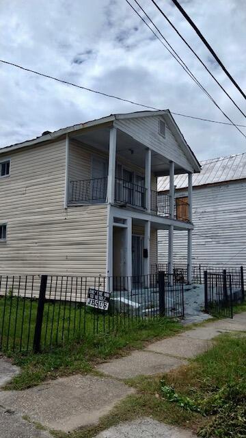 view of property exterior featuring a balcony