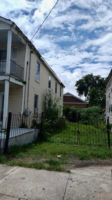 view of side of property with a balcony