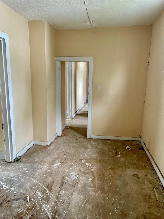 empty room featuring a textured ceiling