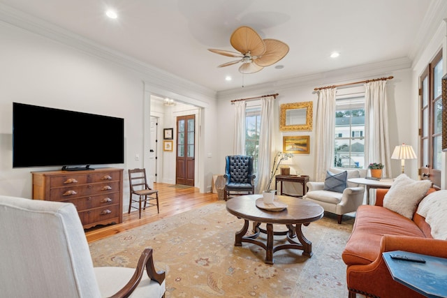 living room with baseboards, recessed lighting, a ceiling fan, wood finished floors, and ornamental molding