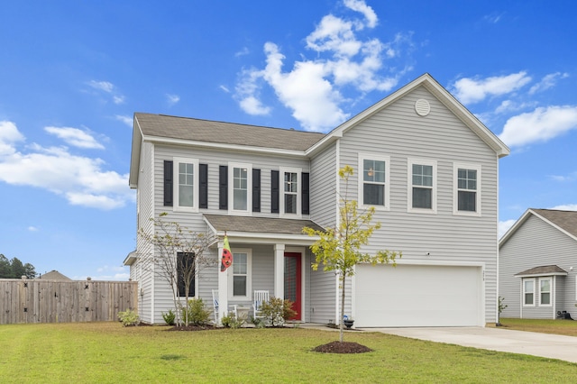 view of front property with a front yard and a garage