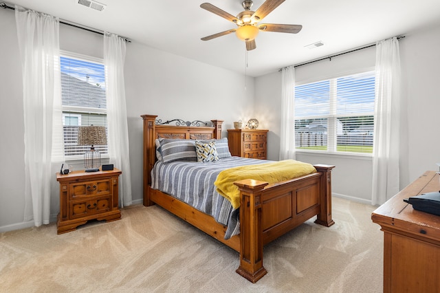 carpeted bedroom with ceiling fan