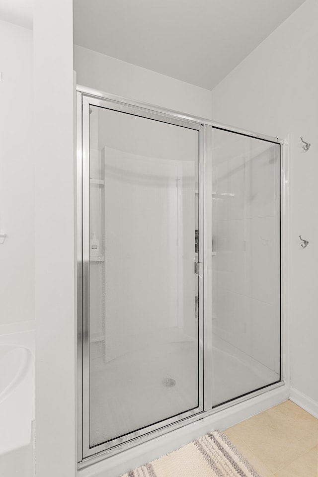 bathroom with a shower with shower door