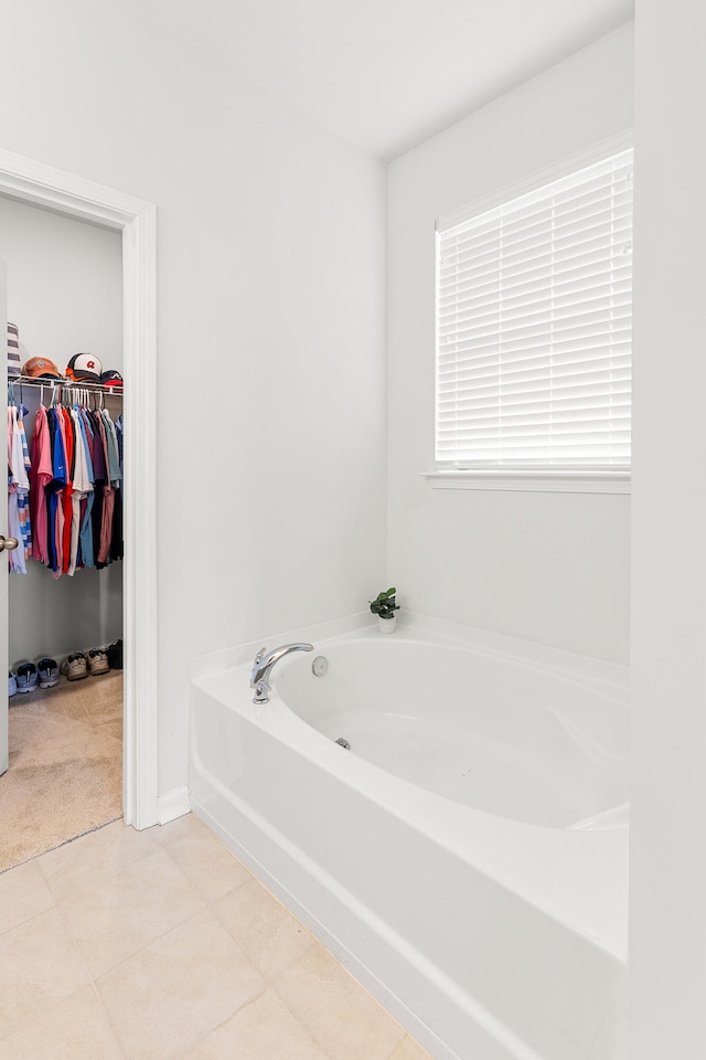 bathroom featuring a bath and tile patterned floors