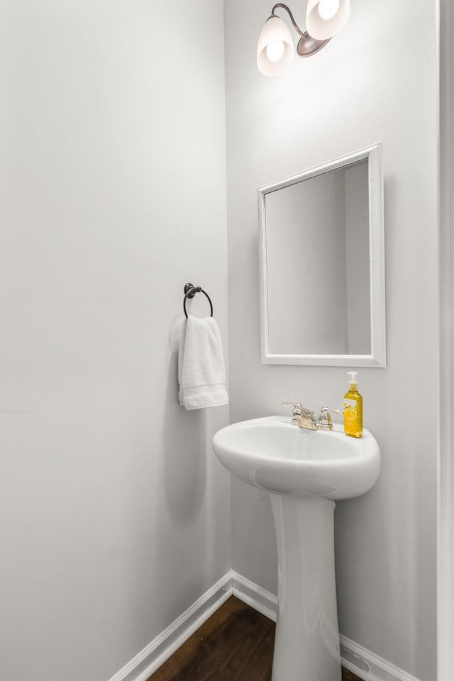 bathroom featuring sink and hardwood / wood-style floors