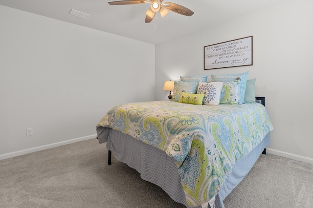 bedroom with ceiling fan and light colored carpet