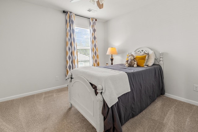 bedroom featuring ceiling fan and light carpet