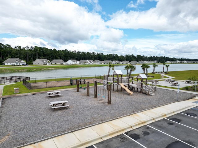 exterior space with a water view and a yard