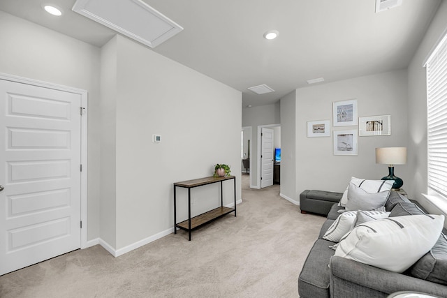living room with light carpet, baseboards, and recessed lighting
