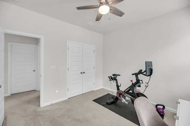 workout room featuring carpet, ceiling fan, and baseboards