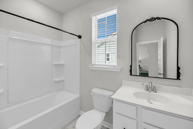 bathroom featuring baseboards, vanity, toilet, and shower / bath combination