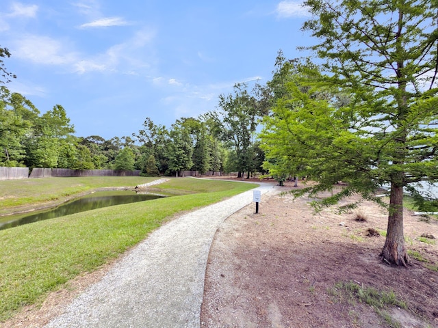 surrounding community with a water view