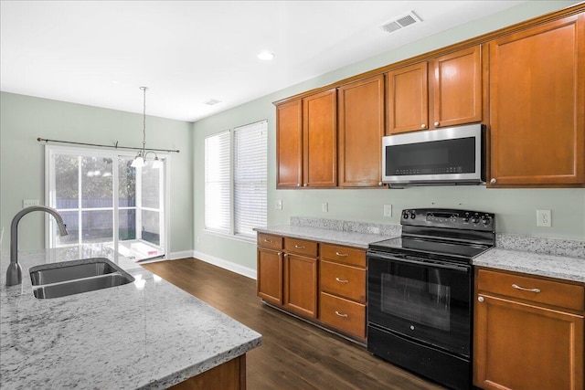 kitchen featuring light stone countertops, electric range, dark hardwood / wood-style floors, and sink